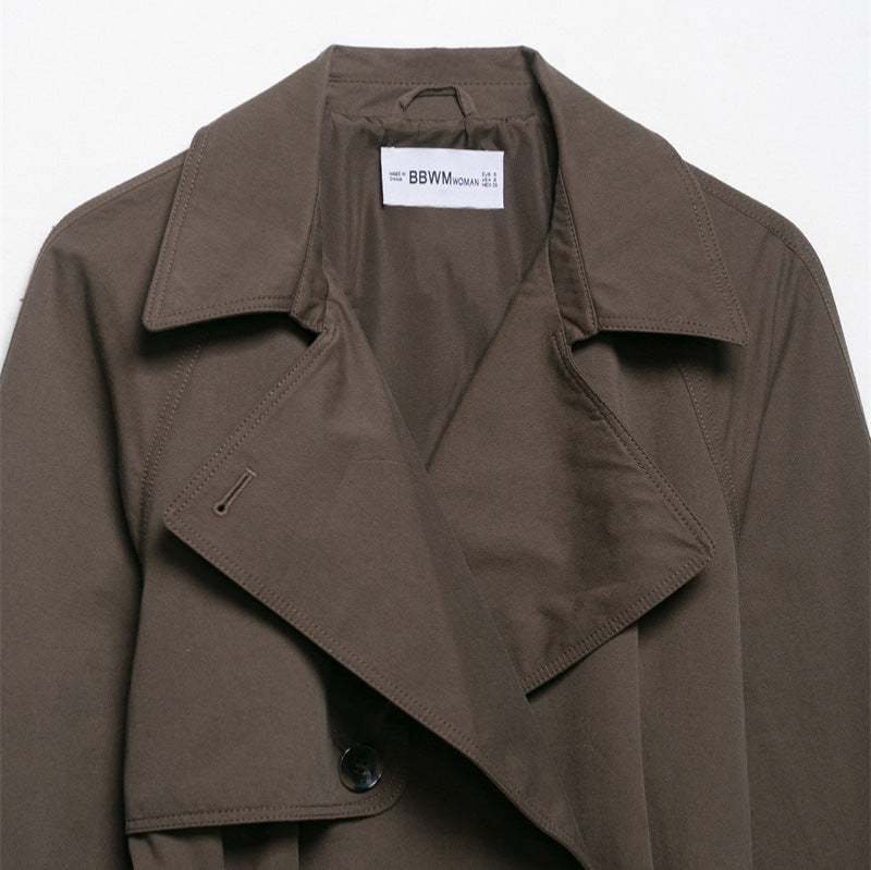 Manteau coupe-vent à ceinture à revers de conception de mode